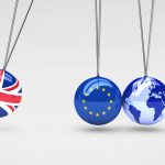 Brexit effect and global business consequences concept with Union Jack, EU flag on balls and world map globe 3D illustration.